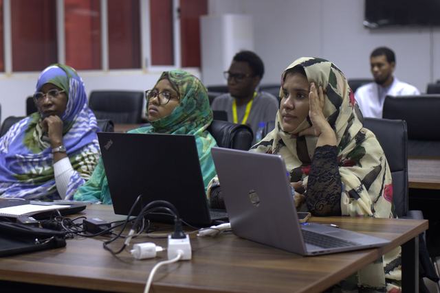 Participants working on computers